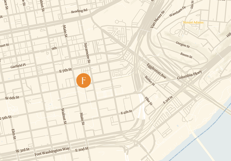 An orange circle with 'F' marks a location on a beige city map.